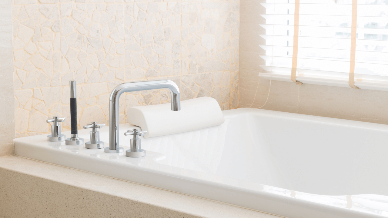 Cozy, light, large bathtub with pillow and faucet equipped